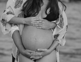 a woman holding a baby